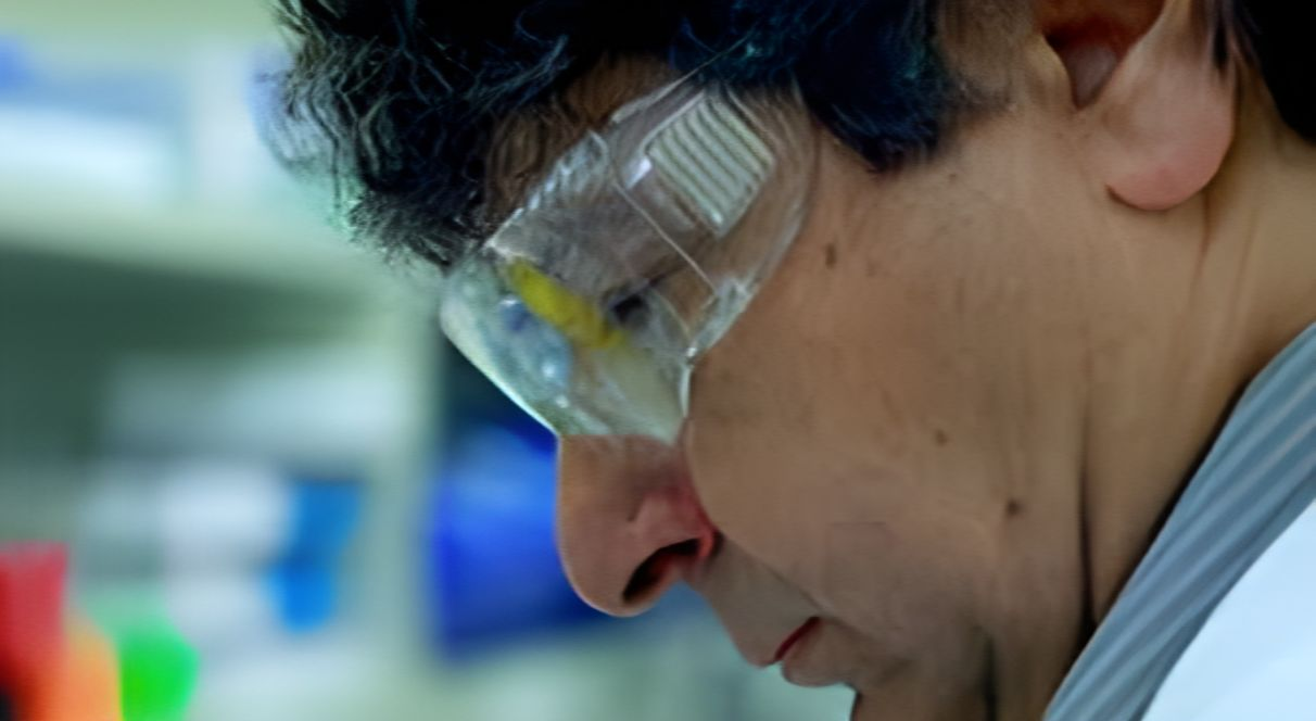 George Kopsidas in protective glasses in the lab
